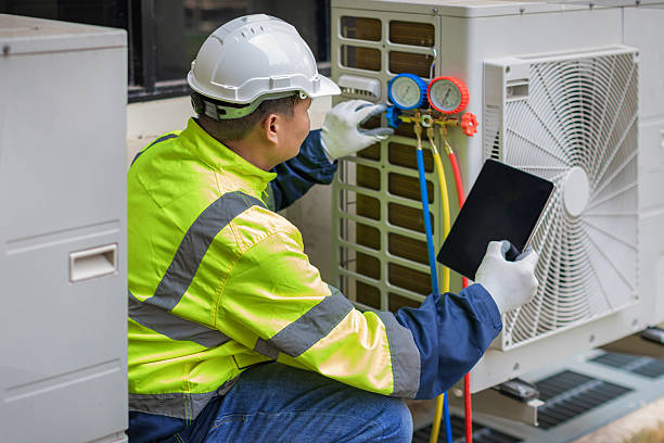 Professional Air Conditioning Repair technician working in Elmwood, MA